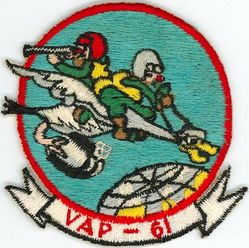 Heavy Photographic Squadron 61 (VAP-61) 
Established as Patrol Squadron SIXTY ONE (VP-61) on 20 Jan 1951. Redesignated: Photographic Squadron SIXTY ONE (VJ-61) on 5 Mar 1952; Heavy Photographic Squadron SIXTY ONE (VAP-61) "World Recorders" in Apr 1956. Composite Photographic Reconnaissance Squadron SIXTY ONE (VCP-61) on 1 Jul 1959. Heavy Photographic Squadron SIXTY ONE (VAP-61) on 1 Jul 1961. Disestablished on 1 Jul 1971.

North American AJ-2P Savage, 1952
Vought F8U-1P Crusader, 1959-1961
Douglas A3D-2P/RA-3B/KA-3B Skywarrior, 1959-1971

Insignia (2nd insignia) approved on 11 Jan 1961


