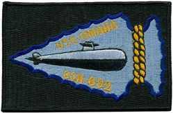 SSN-692 USS Omaha 
Namesake. Omaha, NE
Awarded. 31 Jan 1971
Builder. General Dynamics Corporation
Laid down. 27 Jan 1973
Launched. 21 Feb 1976
Commissioned. 11 Mar 1978
Decommissioned. 5 Oct 1995
Stricken. 5 Oct 1995
Fate. Disposed of by submarine recycling
Class and type. Los Angeles-class Attack submarine
Displacement. 	
5,700 tons light
6,071 tons full
371 tons dead
Length. 110.3 m (361 ft 11 in)
Beam. 10 m (32 ft 10 in)
Draft. 9.7 m (31 ft 10 in)
Propulsion. 	
S6G nuclear reactor, 2 turbines, 35,000 hp (26,000 kW),
1 auxiliary motor 325 hp (242 kW), 1 shaft
Speed. 15 knots (28 km/h) surfaced; 32 knots (59 km/h) submerged
Test depth. 290 m (950 ft)
Complement. 12 officers; 98 enlisted
Armament. 4 × 21 in (533 mm) bow torpedo tubes

