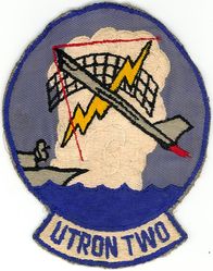 Utility Squadron 2 (VU-2) 
Established as Utility Squadron FOUR (VU-4) Detachment and redesignated Utility Squadron TWO (VU-2) on 8 Jan 1952; Fleet Composite Squadron TWO (VC-2) on 1 Jul 1965. Disestablished on 30 Sep 1980.

Vought F8U-1 Crusader, 1961-1964
Vought F8C/K Crusader, 1964-1971

VU-2's mission was to train aircraft controllers and ship gun crews; provide flights to assist in the completion of functional radar tests for Atlantic Fleet and NATO naval units; conduct of transition training in the FS aircraft for newly designated aviators; and aerial combat maneuvering flights in conjunction with fleet fighter squadron combat readiness training, towed bright red and white targets past firing batteries of U. S. ships and flew high-speed intercepts for stations and ships in the Atlantic Fleet.

Insignia (3rd) submitted for approval to CNO in Feb 1962.


