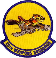 26th Weapons Squadron 
Constituted as 26 Pursuit Squadron (Interceptor) on 20 Nov 1940. Activated on 15 Jan 1941. Redesignated: 26 Pursuit Squadron (Fighter) on 12 Mar 1941; 26 Fighter Squadron (Twin Engine) on 15 May 1942; 26 Fighter Squadron on 1 Jun 1942. Inactivated on 13 Dec 1945. Activated on 15 Oct 1946. Redesignated: 26 Fighter Squadron, Jet-Propelled, on 19 Feb 1947; 26 Fighter Squadron, Jet, on 10 Aug 1948; 26 Fighter-Interceptor Squadron on 1 Feb 1950. Inactivated on 9 Apr 1959. Redesignated 26 Flying Training Squadron on 13 Dec 1989. Activated on 19 Jan 1990. Inactivated on 1 Oct 1992. Redesignated 26 Weapons Squadron on 18 Sep 2008. Activated on 30 Sep 2008.
Emblem. Originally approved on 30 Mar 1945; newest rendition approved on 28 Jan 2009.

