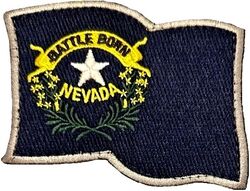 152d Airlift Wing Nevada Flag
Newer design, Nevada changed some flag details in 1991. Aircrew have traditionally worn this on the left shoulder instead of a unit patch. Background is a very dark blue.
