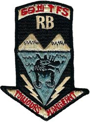 69th Tactical Fornication Squadron
From fighter pilot Mark Berent: "The Rat Beach patch was strictly for my pad in Venice. In 1966, I am back from my first SEA tour. I was assigned to SAMSO in El Segundo and had rented a nifty pad right on the beach in Venice. I called it Rat Beach Air Force Base, home of the 69th TFS (Tactical Fornication Squadron).The Santa Monica mountains are in the background, the wolf coming from the water is looking ad sinistram, to the left, meaning illegitimate. The French is misspelled meaning always eating." 
