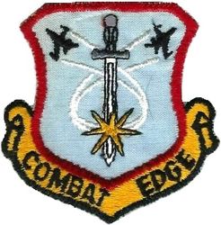 Gentex Combat Edge Flight Equipment
Combat Edge is flight gear like the G-suit and helmet that helps pilots withstand the amount of G forces the newer generation fighters can pull. It started with the F-16 in the late 80s and has evolved since. This patch came out then with the initial CE gear. Note the two F-16 like shapes as well. I started seeing CE gear in squadron use in the mid-90s.
