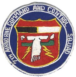 7th Airborne Command and Control Squadron
Significance* provided by the unit: Air Force golden-yellow, the sun and excellence required of Air Force personnel. Ultramarine blue, the sky, primary theater of Air Force operations. Red, valor and courage of the members of the squadron demonstrated in the skies of Southeast Asia. Black symbolizes the night-time operations of the 7 ACCS aircraft and crews, maintaining their constant 24 hour vigil during the war. White represents the long and tedious daytime operations conducted by squadron members. Green, the primary color of the camouflaged aircraft and capsules of the 7 ACCS. White bird symbolizes the uniquely modified C-130E aircraft equipped to function as the airborne platform which carries the command and control capsule. Green capsule represents the USC-15 Airborne Battlefield Command and Control Capsule. Lightning bolts symbolize the extensive communications aboard the ABCCC capsule and the unique capability of the airborne platform to function as an Airborne Battlefield Command and Control Center.

 The unit that wore this patch was activated 13 Feb 1968. Wear of this version continued until after the unit had been at Keesler for a couple years and the officially approved version (yellow disc) was procured (1977). 

 *Never officially approved (though much of this significance was incorporated into the subsequent emblem that was approved). In a letter to USAFMPC, dated 21 June 1976, the squadron commander related that the unit had only just discovered that the emblem it had been using since the late 1960s was never submitted for official approval. In an impassioned plea, he gave many good reasons why this wartime emblem should be approved. It wasn't, and the yellow-disc version followed soon thereafter.

 NOTE: I don't know if the last word was "SQUAD" intentionally or if "SQUADRON" was never finished (the positioning suggests the latter), but there is no evidence of removed embroidery. All other versions I've seen have "SQUADRON." 
