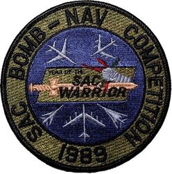 Strategic Air Command Bomb-Nav Competition 1989
Thirty-third Annual Bombing and Navigation Competition/PROUD SHIELD 89 was the first year a B-1B unit took the Fairchild Trophy. A new trophy, the Maynard “Snuffy” Smith B-52 Gunnery Trophy was
awarded for the first time to recognize the top scoring B-52 unit in gunnery and fighter defense activity.
Keywords: subdued