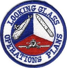 2d Airborne Command and Control Squadron Operations Plans
2 ACCS/DOCX Functional patch created ca. 1991 and based upon a design by Lt Cols Ken Hurt and Ray Watts, and Majs Mike Wise and Bob Trummer. It depicts the three legs of the nuclear Triad. It was worn on the left shoulder by the Single Integrated Operational Plan (SIOP) Advisors on the battlestaff who led the Planning Team (Intel, Logistics, and sometimes Weather and Engineering, officers). 
